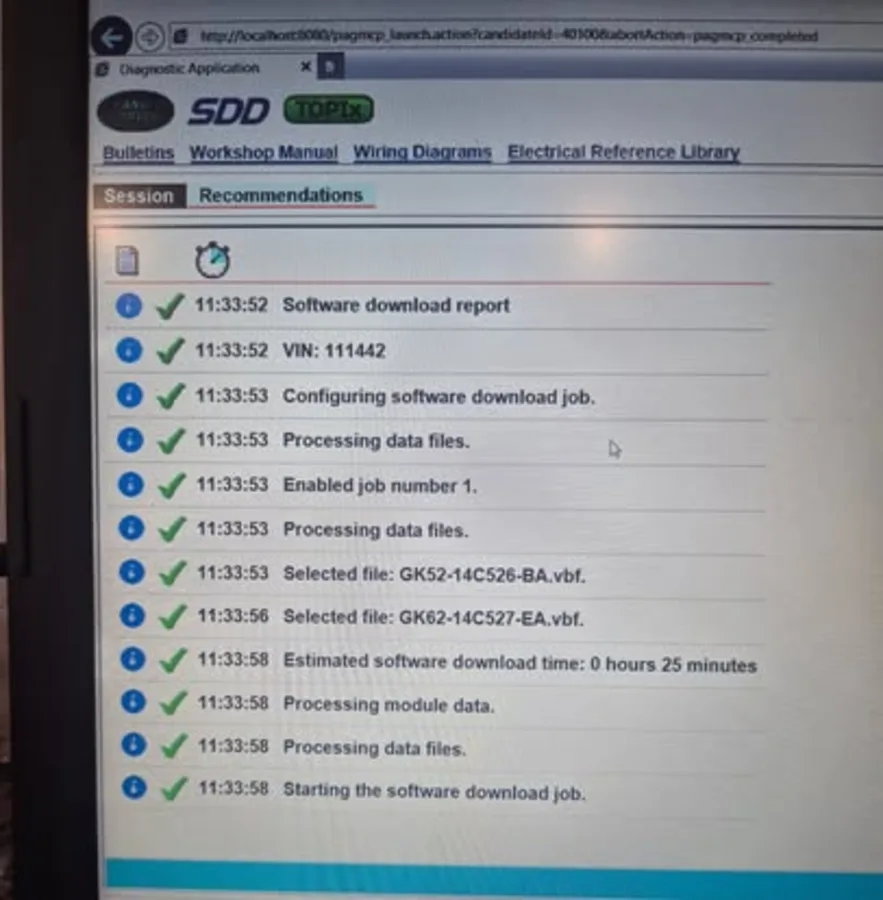 Vehicle software diagnostic process displayed on a workshop computer